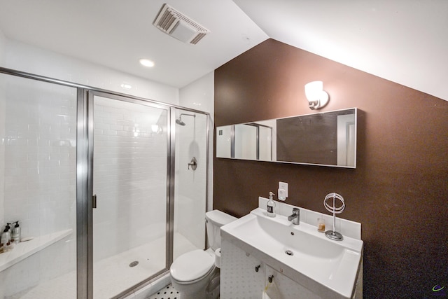 bathroom featuring a stall shower, visible vents, toilet, vaulted ceiling, and vanity