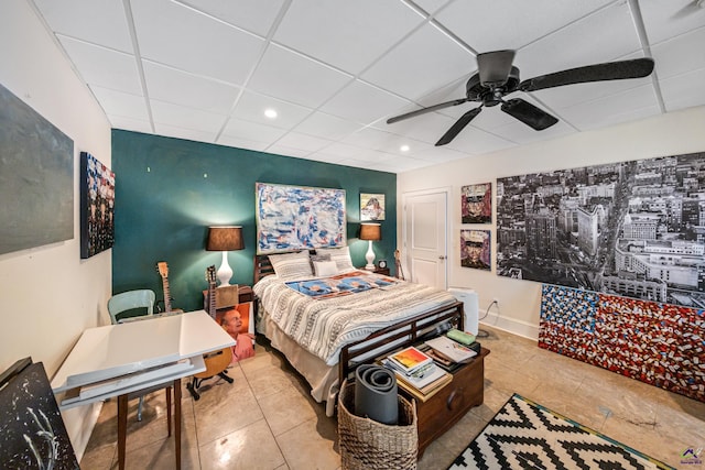 bedroom with tile patterned flooring, a paneled ceiling, recessed lighting, a ceiling fan, and baseboards