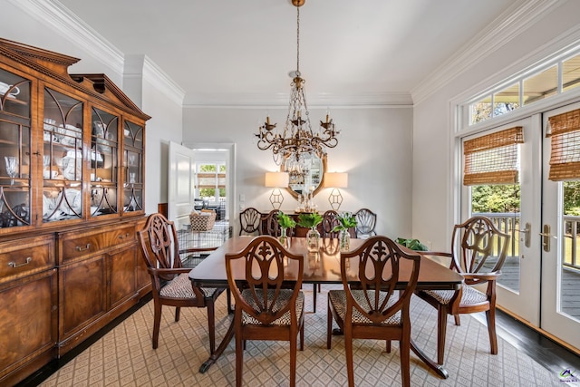 dining area with plenty of natural light, ornamental molding, wood finished floors, and french doors