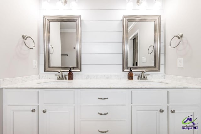 full bath featuring a sink and double vanity