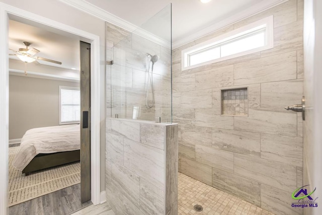 ensuite bathroom featuring ornamental molding, ensuite bath, walk in shower, and a ceiling fan