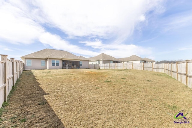 view of yard with a fenced backyard