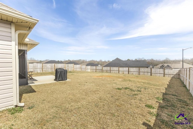 view of yard with a fenced backyard and a patio