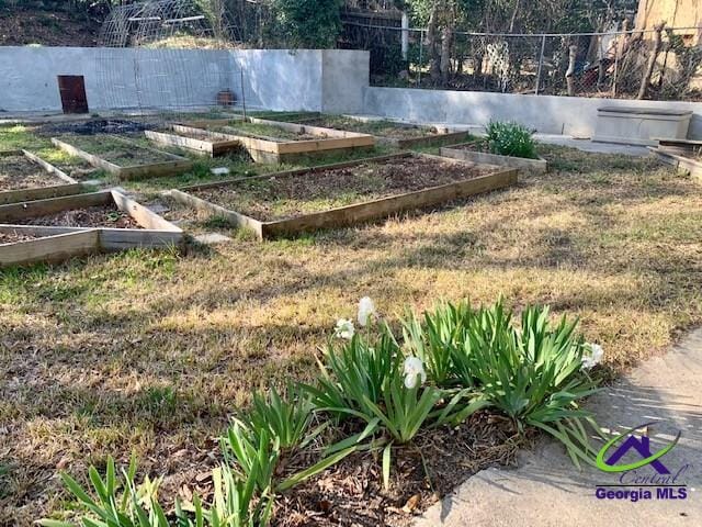 view of yard featuring a garden and fence