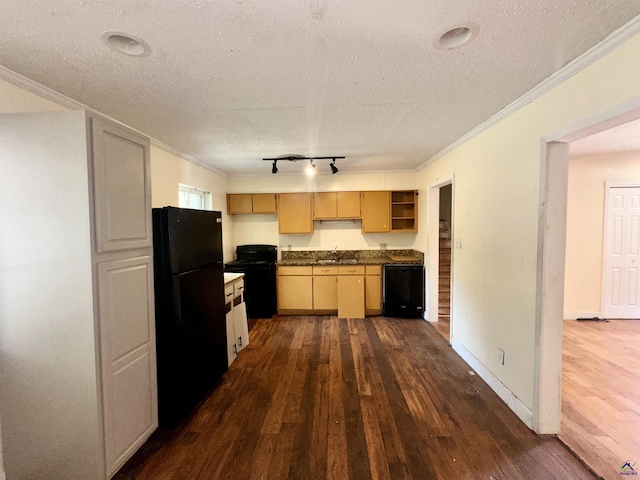 kitchen featuring dark wood finished floors, dark countertops, ornamental molding, a textured ceiling, and black appliances