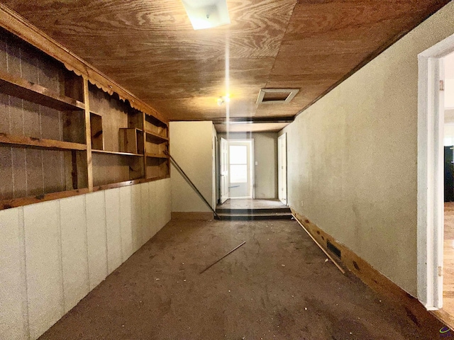 below grade area with wooden ceiling