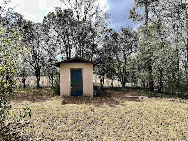 view of shed with fence