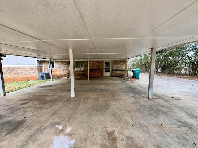 view of patio / terrace featuring central air condition unit and a carport