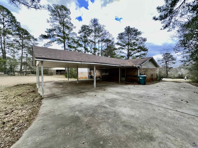 view of parking featuring concrete driveway