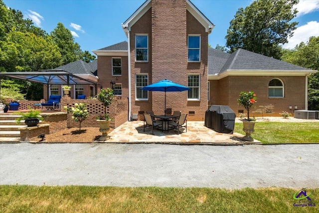 rear view of property featuring a chimney, crawl space, a patio area, and central air condition unit