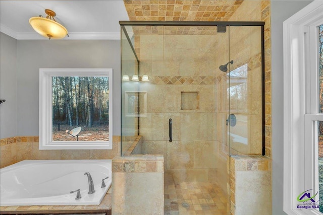 full bath with ornamental molding, a stall shower, and a garden tub