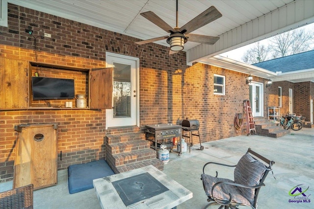 view of patio with a ceiling fan, entry steps, and area for grilling