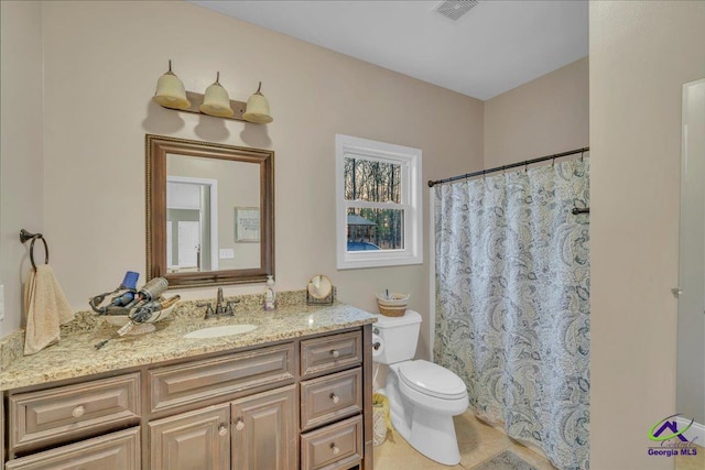 bathroom with toilet, vanity, visible vents, a shower with curtain, and tile patterned floors