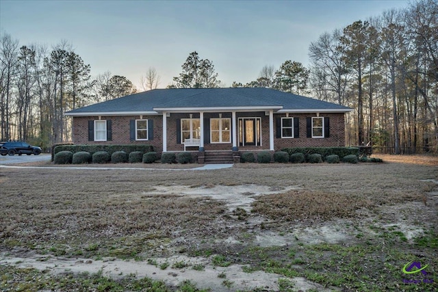 view of front of house featuring brick siding