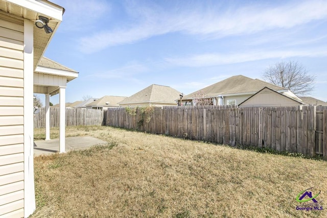 view of yard with a patio and a fenced backyard