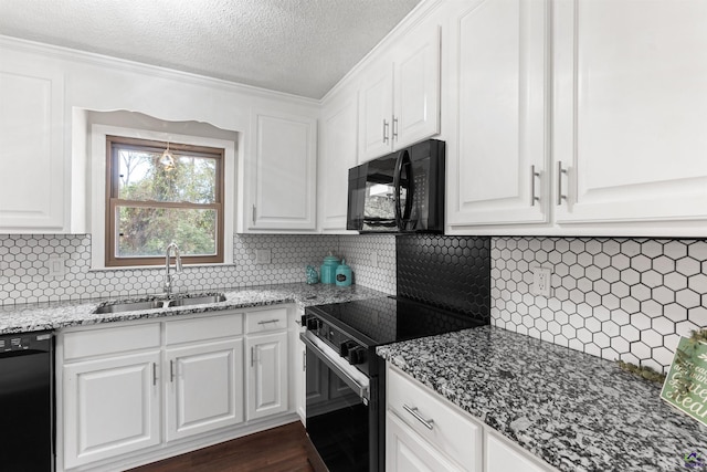 kitchen featuring decorative backsplash, white cabinets, dark wood-type flooring, black appliances, and a sink