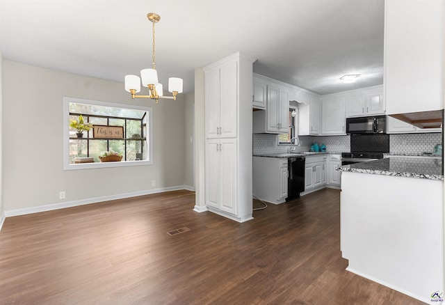 kitchen with dark wood-style flooring, visible vents, white cabinetry, backsplash, and black appliances