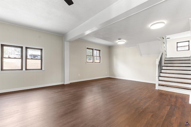 unfurnished living room featuring baseboards, a ceiling fan, stairway, dark wood-style flooring, and a textured ceiling