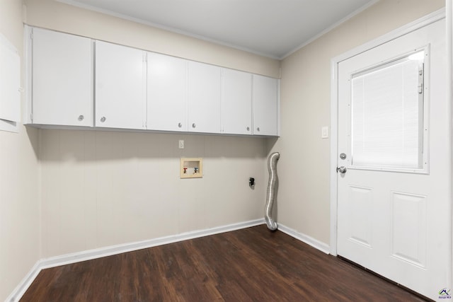 laundry room with dark wood-style flooring, hookup for a washing machine, cabinet space, and baseboards