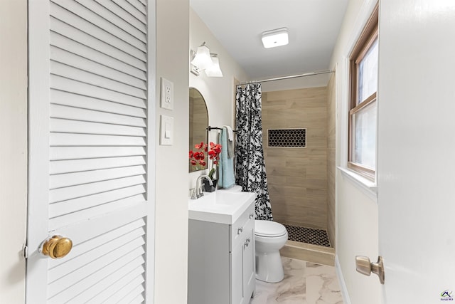 full bath featuring toilet, marble finish floor, a stall shower, and vanity