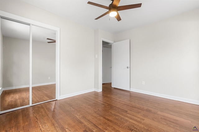 unfurnished bedroom featuring a ceiling fan, baseboards, and wood finished floors