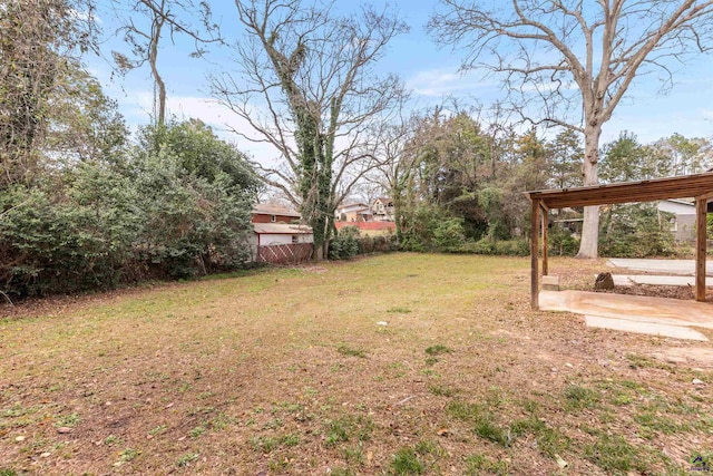 view of yard featuring a patio area and fence