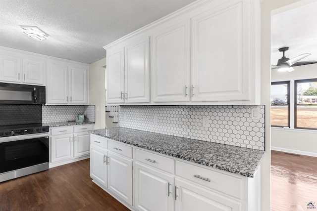 kitchen with dark wood-style floors, black microwave, white cabinetry, and range with electric stovetop