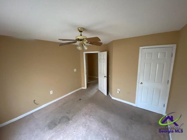 unfurnished bedroom featuring ceiling fan and baseboards