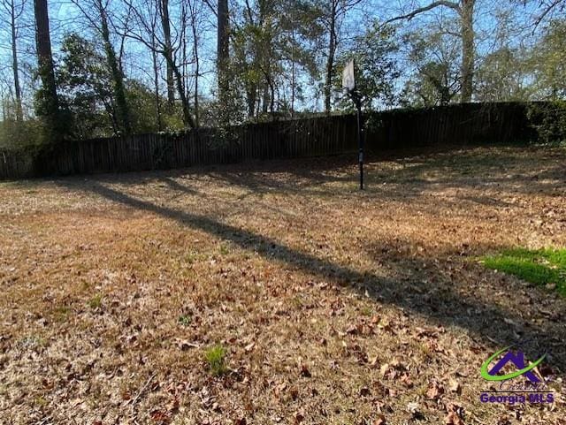 view of yard with fence