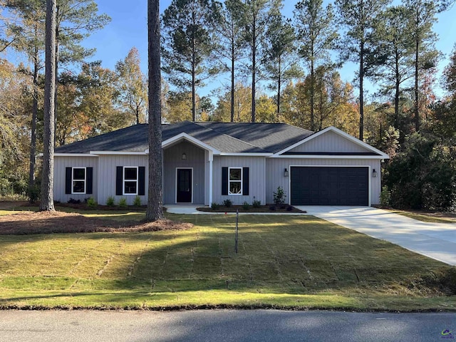 ranch-style house with driveway, a front lawn, and an attached garage