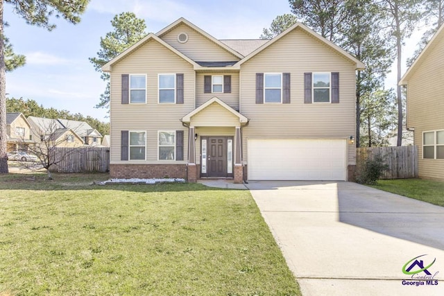 view of front of property with brick siding, concrete driveway, a front yard, fence, and a garage