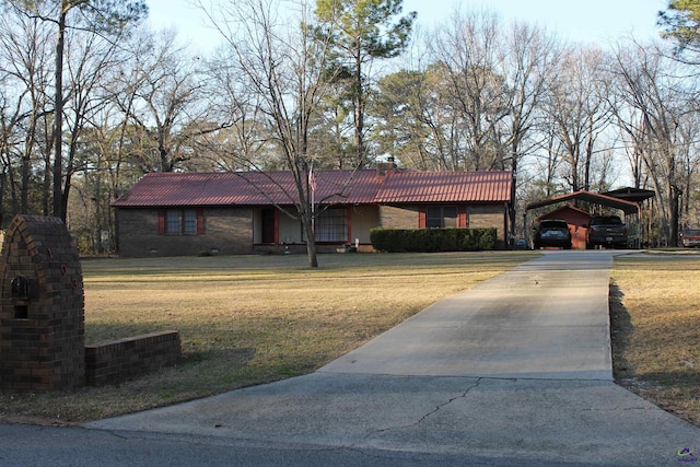 ranch-style house featuring a tile roof, concrete driveway, crawl space, a carport, and a front yard