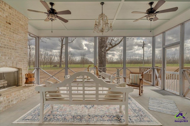 sunroom / solarium featuring ceiling fan