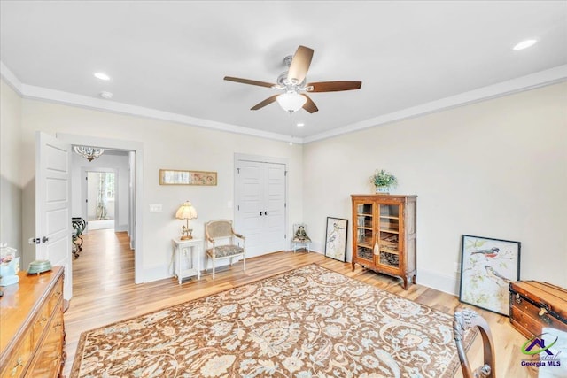 home office with recessed lighting, a ceiling fan, baseboards, ornamental molding, and light wood-type flooring