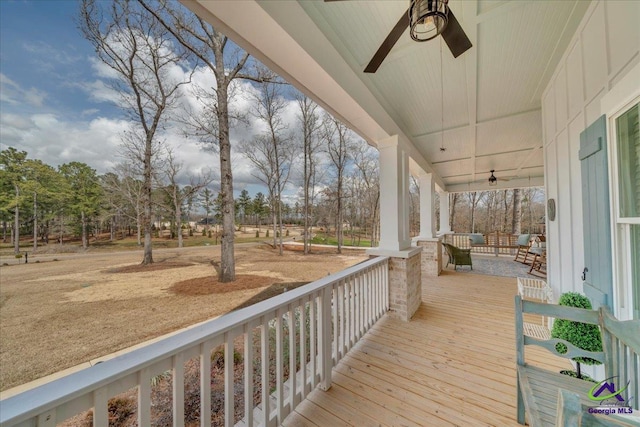 deck featuring a ceiling fan and covered porch