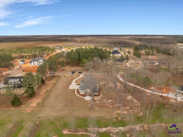 birds eye view of property with a rural view