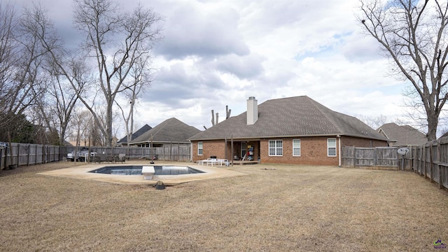 view of swimming pool featuring a fenced backyard and a patio