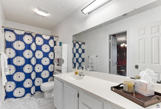 bathroom featuring marble finish floor, a shower with shower curtain, toilet, a textured ceiling, and vanity