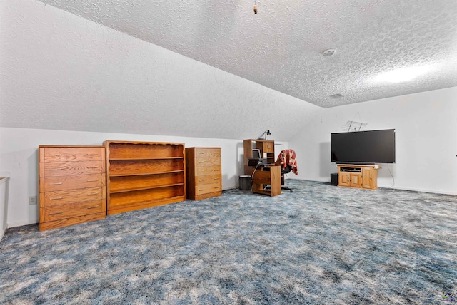 bonus room with lofted ceiling, carpet floors, and a textured ceiling