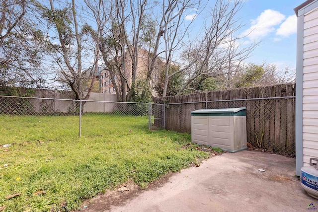 view of yard featuring a patio area and a fenced backyard