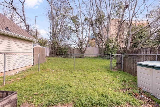 view of yard with a fenced backyard