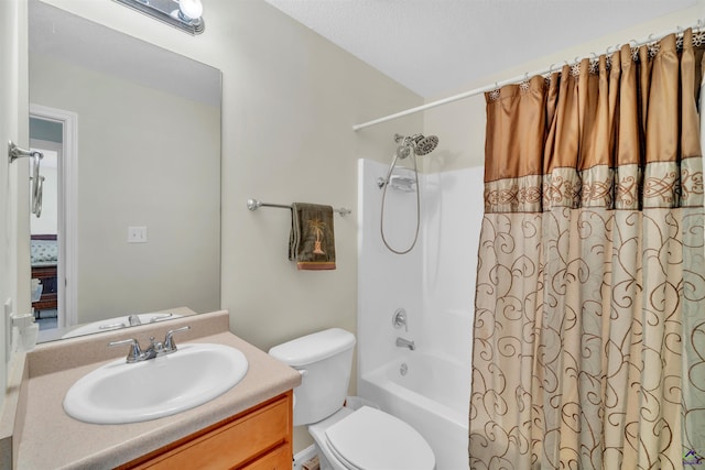 bathroom featuring toilet, shower / bath combination with curtain, and vanity