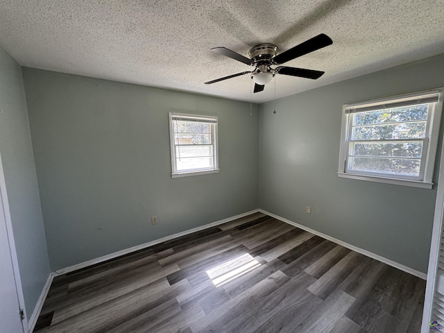 empty room featuring a ceiling fan, a textured ceiling, baseboards, and wood finished floors