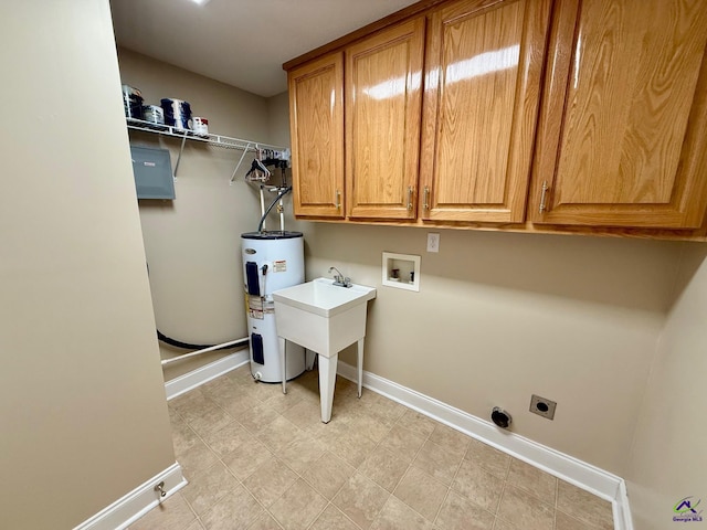 washroom with hookup for a washing machine, cabinet space, water heater, hookup for an electric dryer, and baseboards