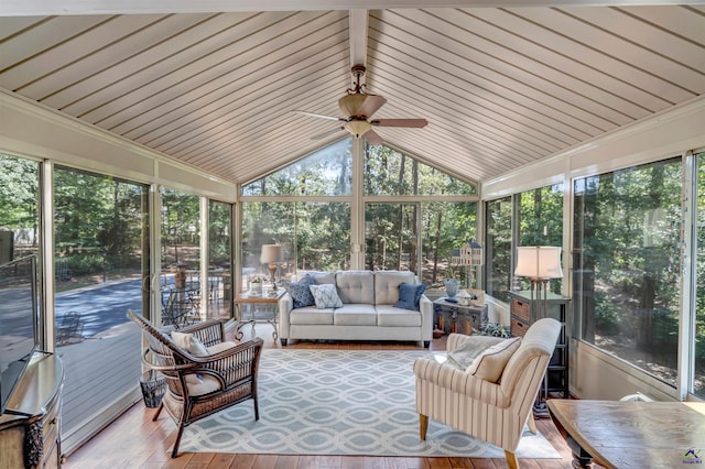 sunroom / solarium featuring lofted ceiling and ceiling fan