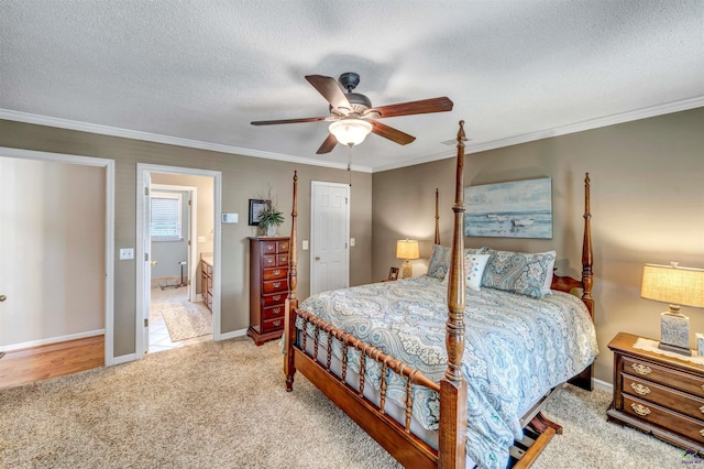 bedroom featuring a ceiling fan, carpet, ornamental molding, and a textured ceiling