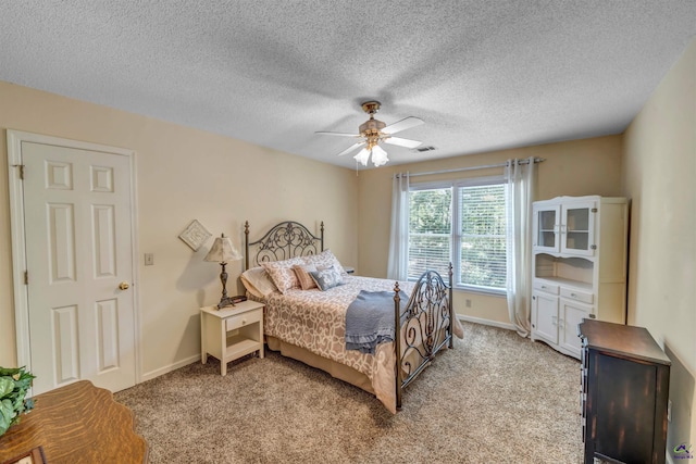 bedroom featuring light carpet, baseboards, and visible vents