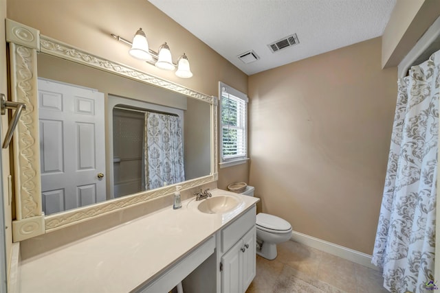 bathroom with toilet, baseboards, visible vents, and a textured ceiling