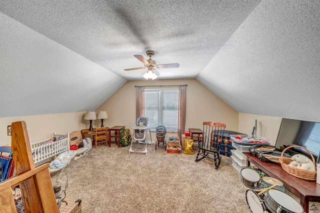 playroom with carpet, ceiling fan, and lofted ceiling