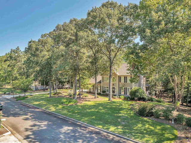 view of front of house featuring a front lawn and stucco siding